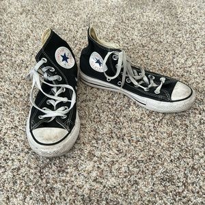 Size 7.5 women’s black high top chucks.